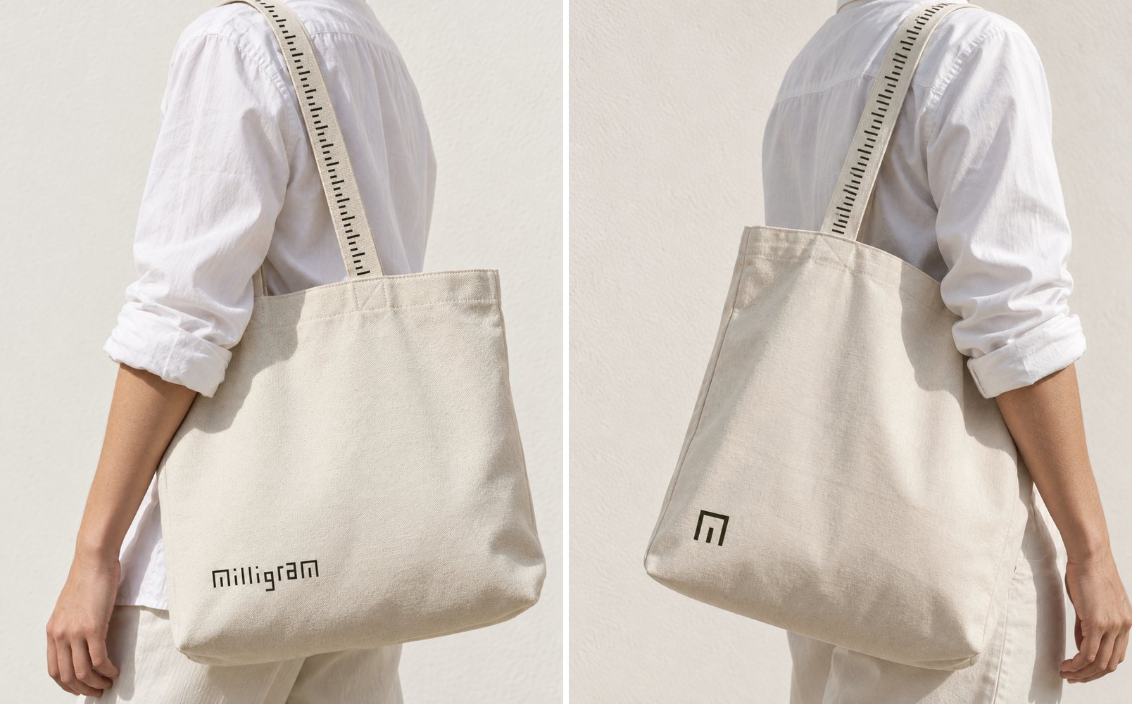two canvas totes on tape-measure straps, one printed with the wordmark, one with the m symbol